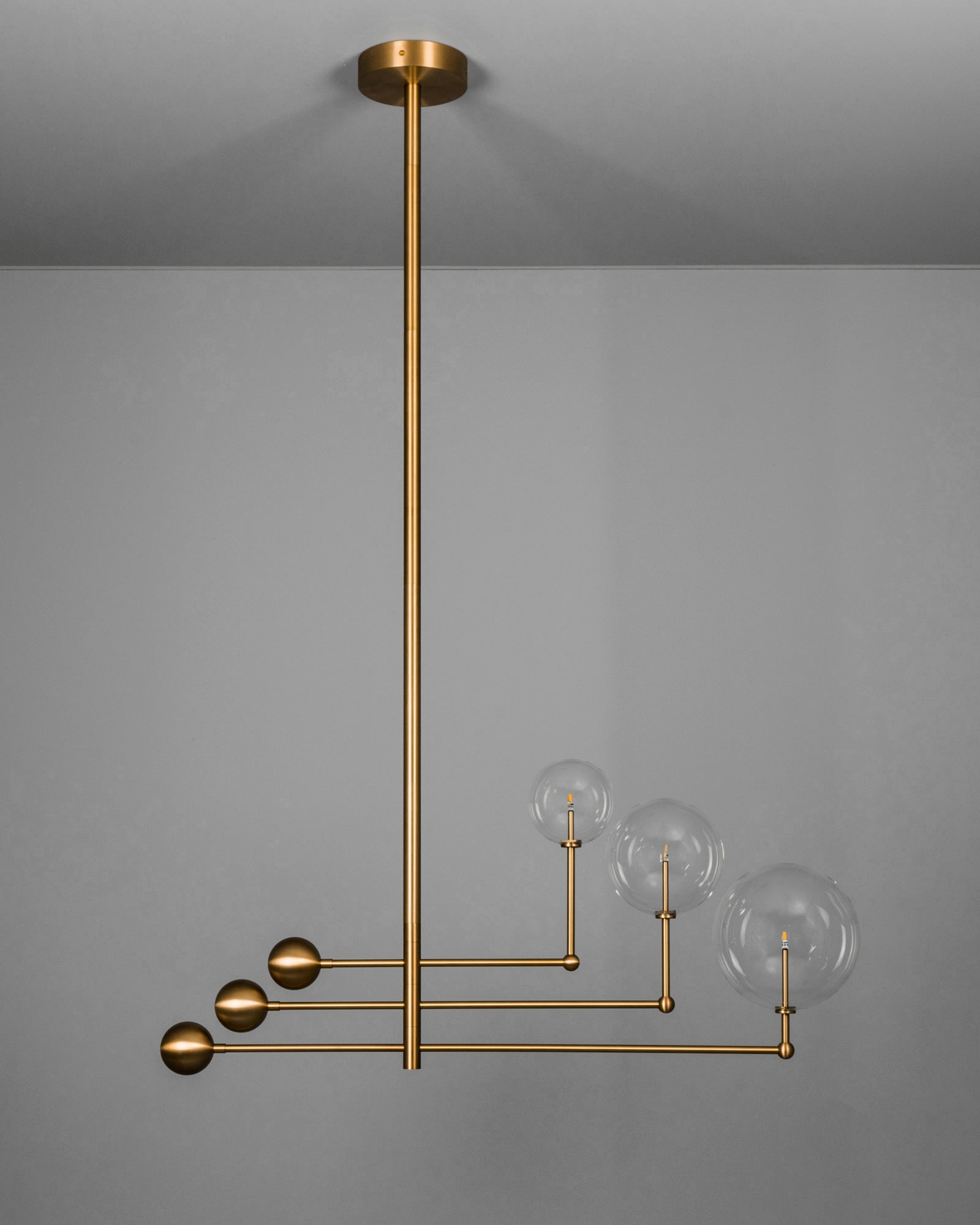 Schwung Universe Burnished Brass Transparent Globe Chandelier